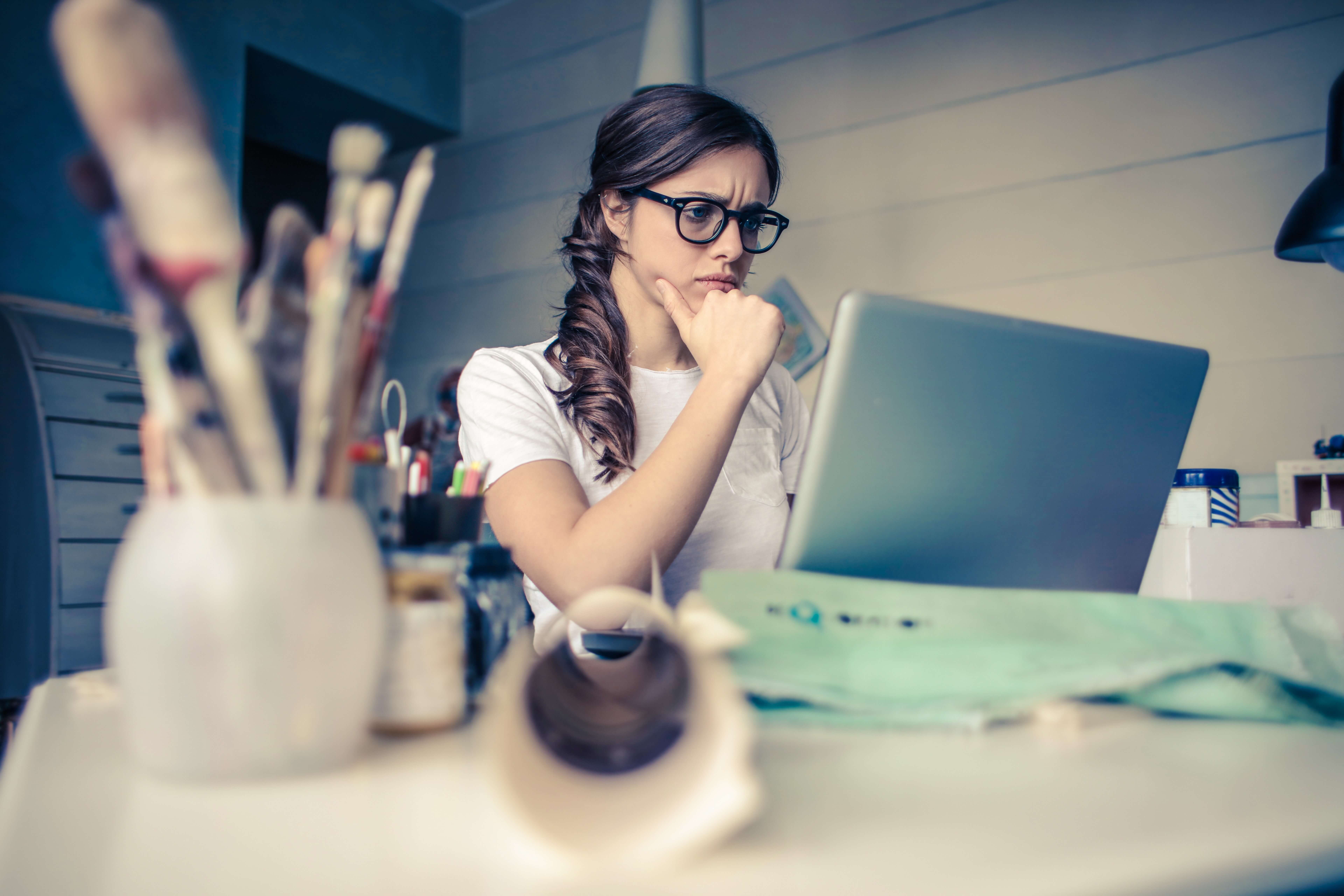 woman staring at computer